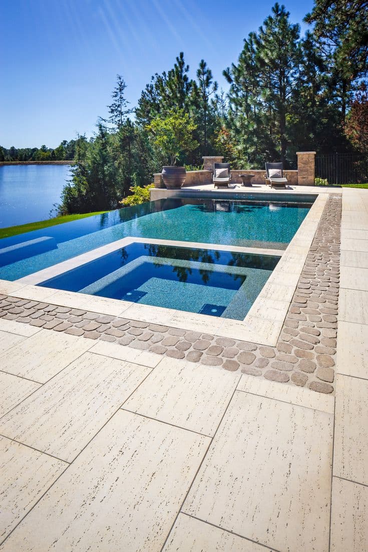 Travertine pool deck with flush slot drainage